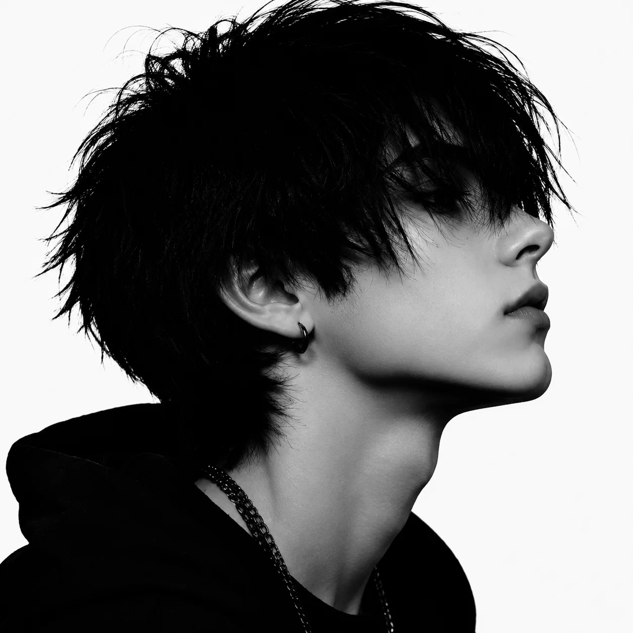 black-white-emo-pfp-high-contrast-side-profile-dark-hair Black and white emo pfp with high contrast side profile, dark swept hair, and sharp jawline for cinematic Discord avatar